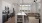 Kitchen with open living room with sunlit windows and open shelves in island