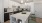 Kitchen island with open shelving and stainless steel appliances