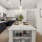 Cook in style with Electrolux stainless steel appliances, wood-style plank flooring, and elegant tile backsplashes.