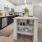 Cook in style with Electrolux stainless steel appliances, wood-style plank flooring, and elegant tile backsplashes.